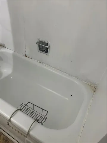 a bedroom with a bed and cabinets