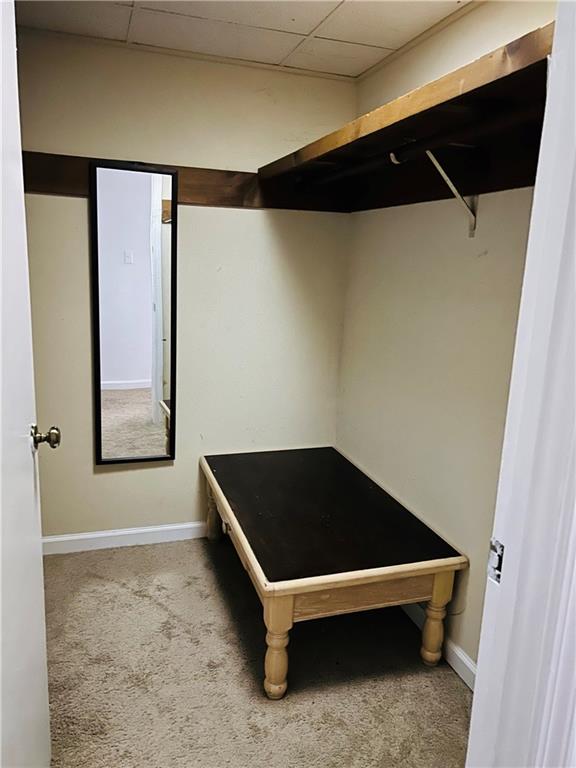 55 Johnson Ferry Road Atlanta, GA 30328 - Photo 22 of 30 a bedroom with a bed and cabinets