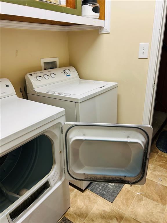 55 Johnson Ferry Road Atlanta, GA 30328 - Photo 23 of 30 a utility room with dryer and washer