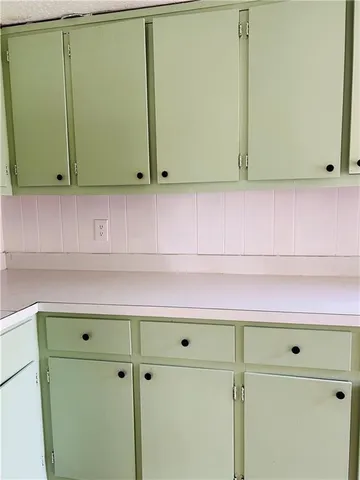 a view of storage and utility room with washer and dryer