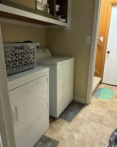 a kitchen with a refrigerator and a stove