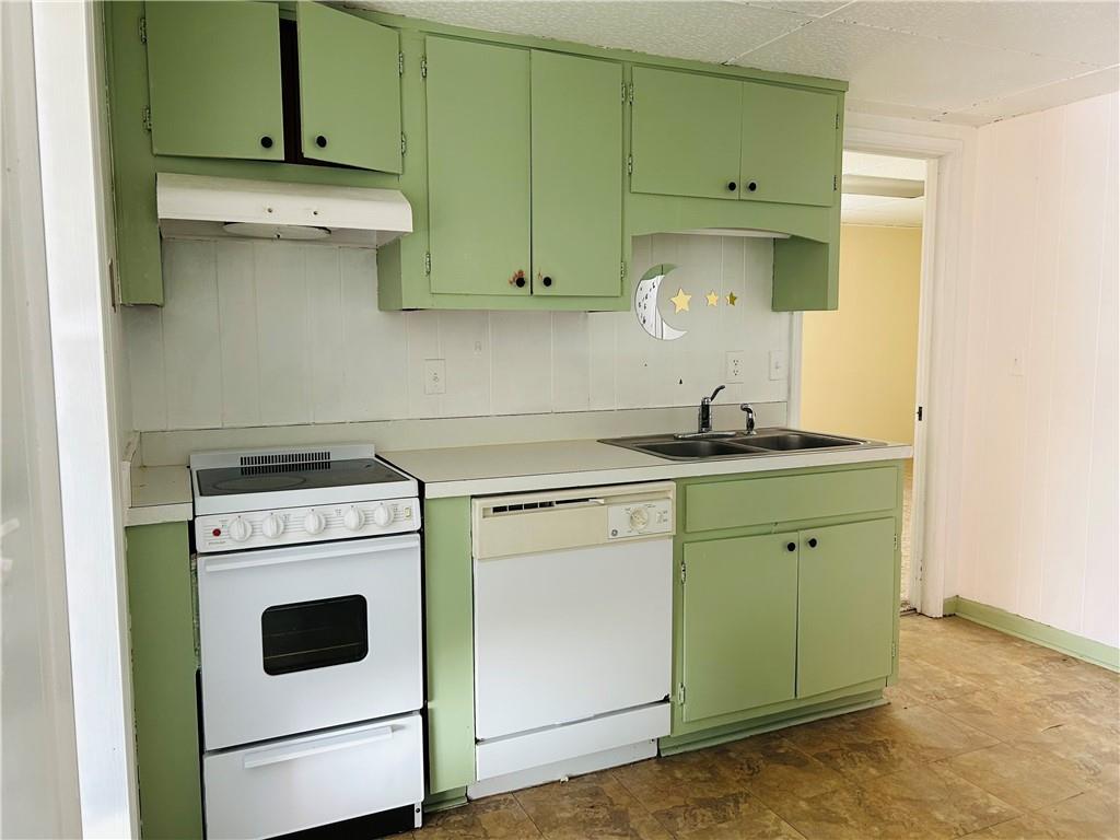 55 Johnson Ferry Road Atlanta, GA 30328 - Photo 7 of 30 a kitchen with cabinets a washer and dryer