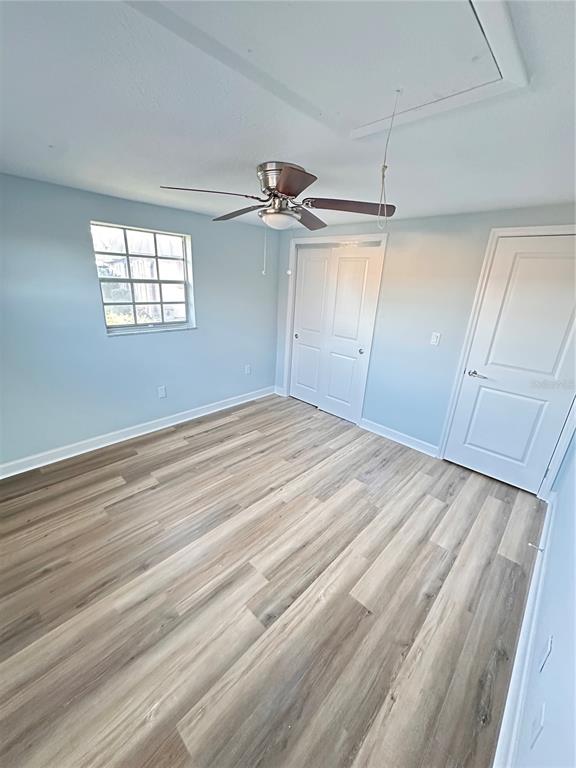 4407 Summersun Drive New Port Richey, FL 34652 - Photo 13 of 34 wooden floor in an empty room with a window