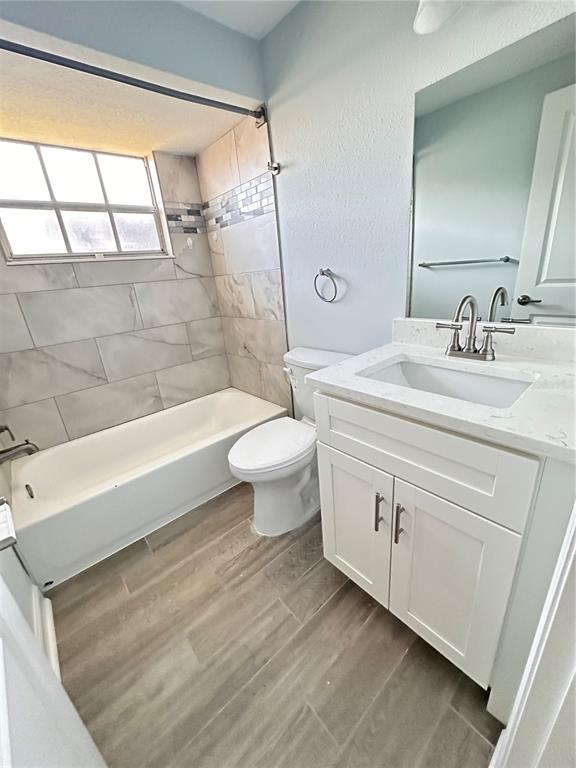 4407 Summersun Drive New Port Richey, FL 34652 - Photo 15 of 34 a bathroom with a sink a toilet and shower