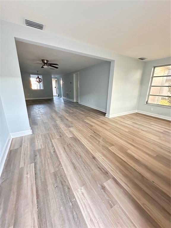 4407 Summersun Drive New Port Richey, FL 34652 - Photo 23 of 34 a view of empty room with wooden floor and fan