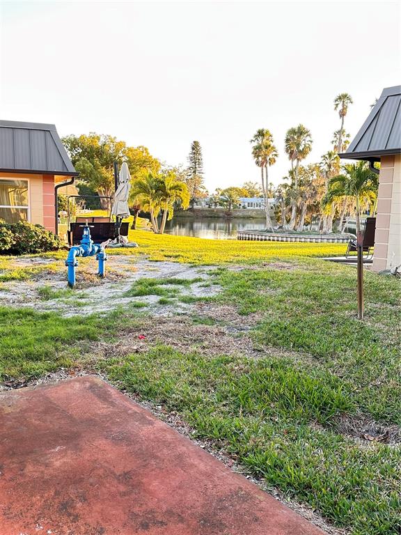 4407 Summersun Drive New Port Richey, FL 34652 - Photo 30 of 34 a view of a fountain in front of a house with a big yard