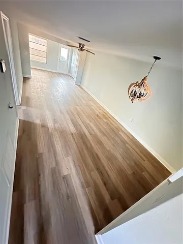 a view of a chairs and table in the balcony