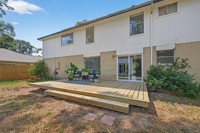 a view of backyard with a patio