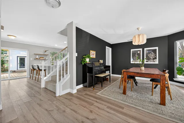 a view of a livingroom with furniture and wooden floor