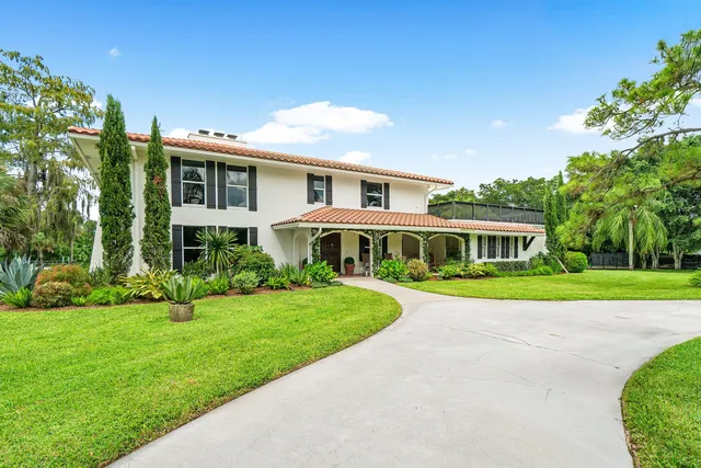a view of a livingroom with furniture and stairs
