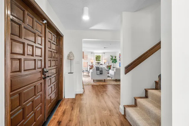 a view of a dining table and chairs in a room