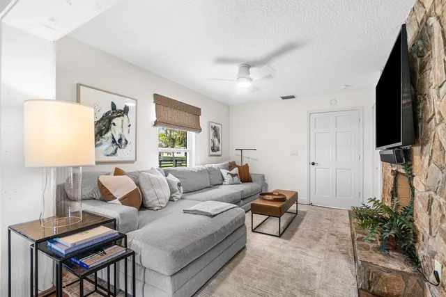 a bedroom with a large bed and a flat screen tv