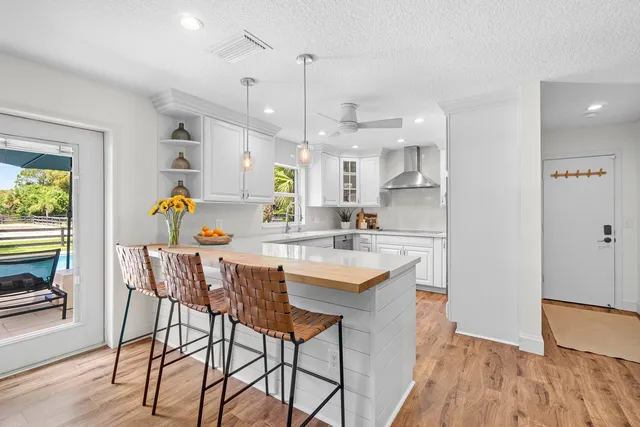 a large bed sitting in a bedroom next to a window