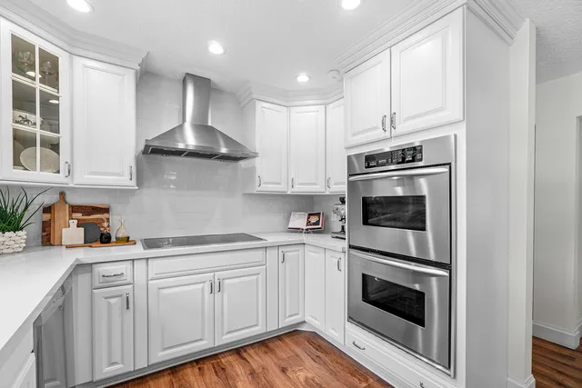 a bathroom with a sink toilet a mirror and shower