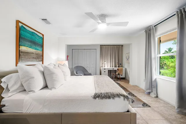 a view of a house with swimming pool and sitting area