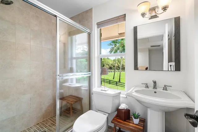 a view of a swimming pool with lounge chairs in patio