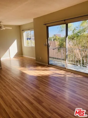 a view of wooden floor and brick walls