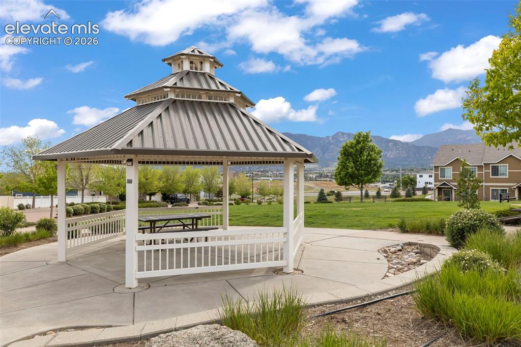 1563 Monterey Road, Unit D Colorado Springs, CO 80910 - Photo 22 of 22 a view of a garden with a patio