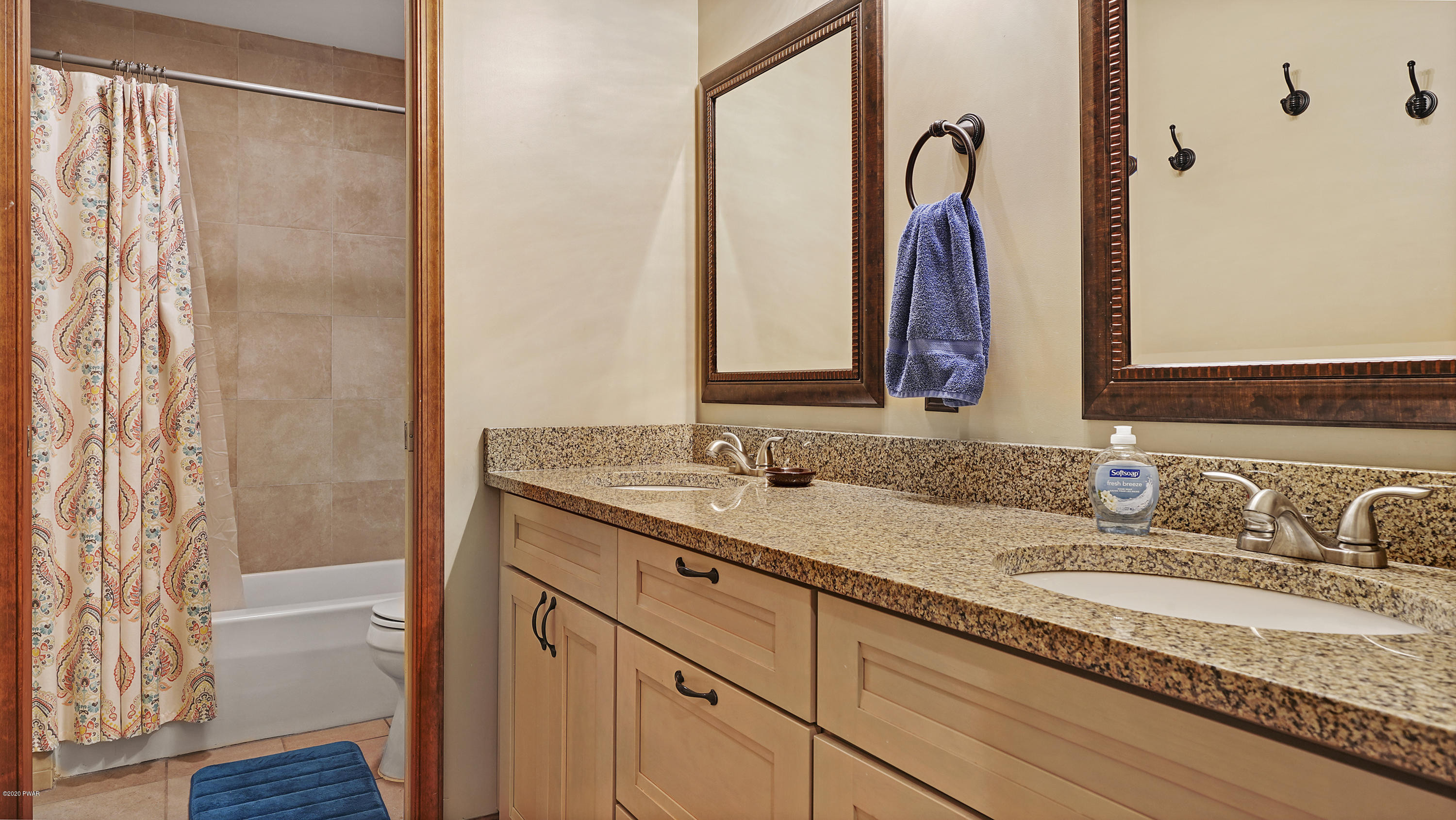 161 J J Road Moscow, PA 18444 - Photo 53 of 73 a bathroom with a granite countertop sink and a mirror