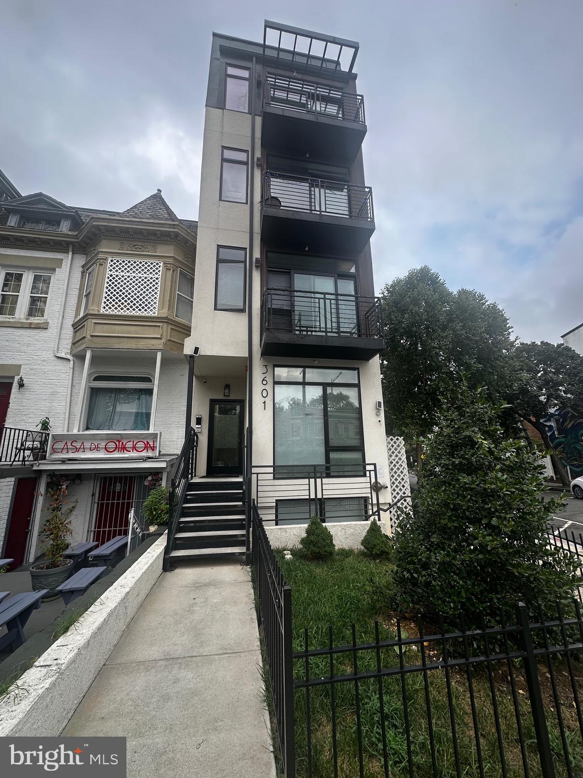 3601 14th Street Northwest Washington, DC 20010 - Photo 1 of 31 a front view of a house with a garden