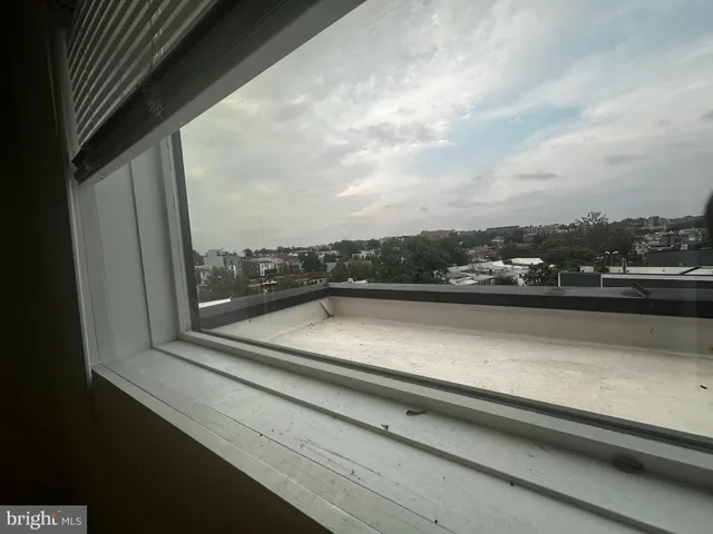 a view of an empty room with a fireplace