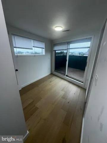 a view of wooden floor in an empty room