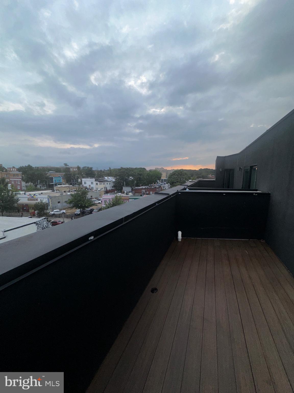 3601 14th Street Northwest Washington, DC 20010 - Photo 25 of 31 a view of roof deck with wooden floor and fence