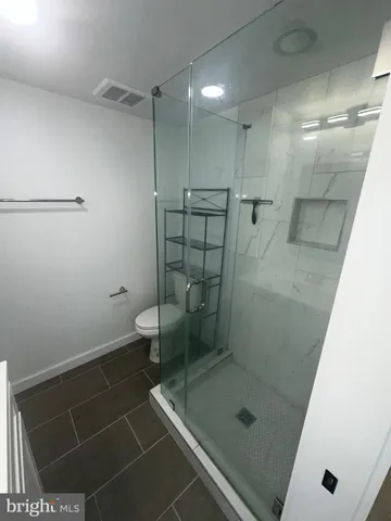 a swimming pool with outdoor seating and city view