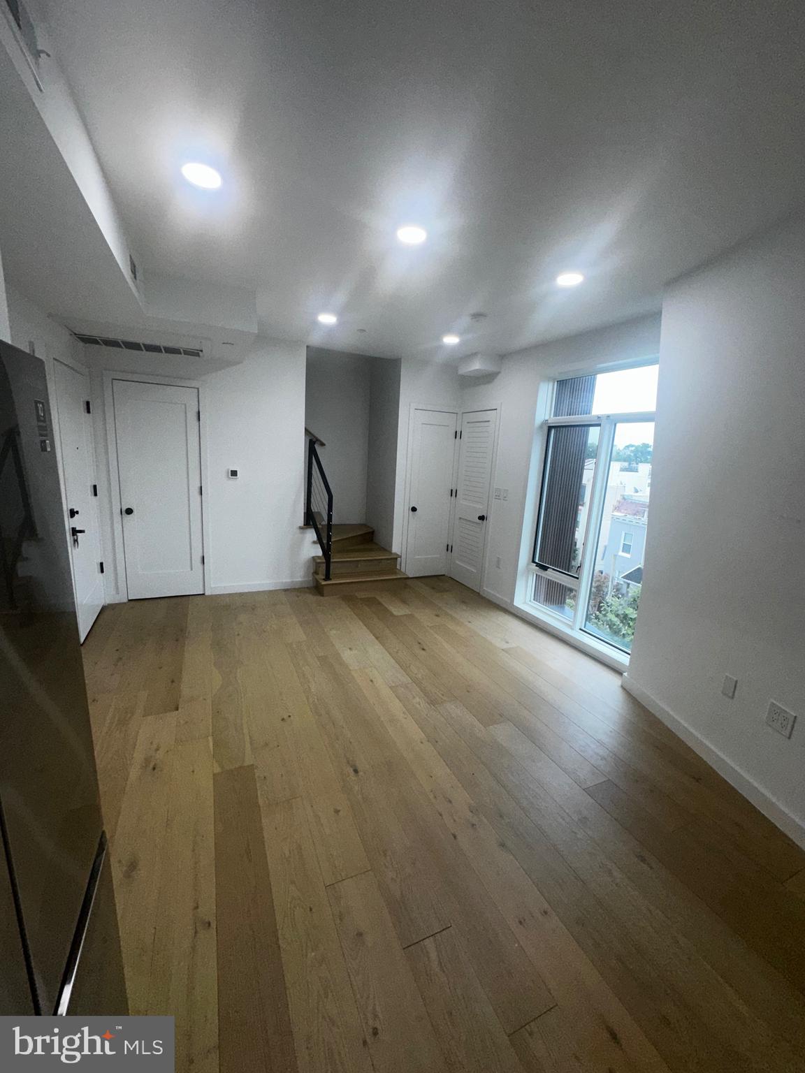 3601 14th Street Northwest Washington, DC 20010 - Photo 6 of 31 an empty room with wooden floor and windows