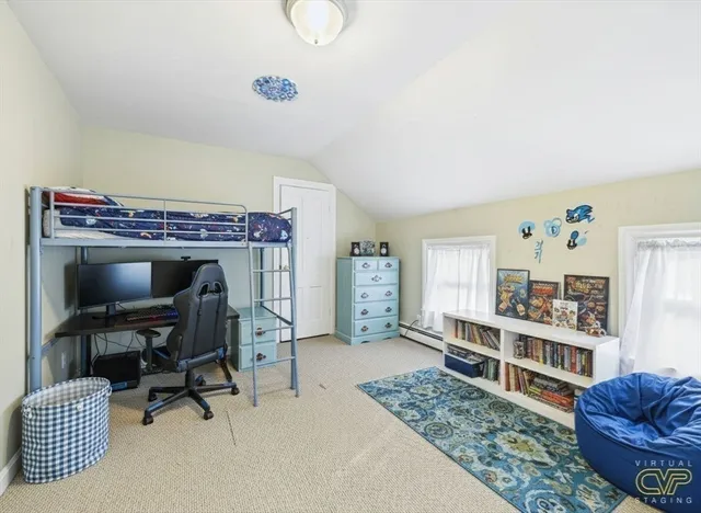 a living room with furniture a piano and a bookshelf