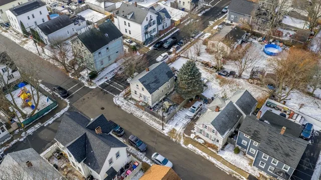 an aerial view of a residential apartment building with a yard