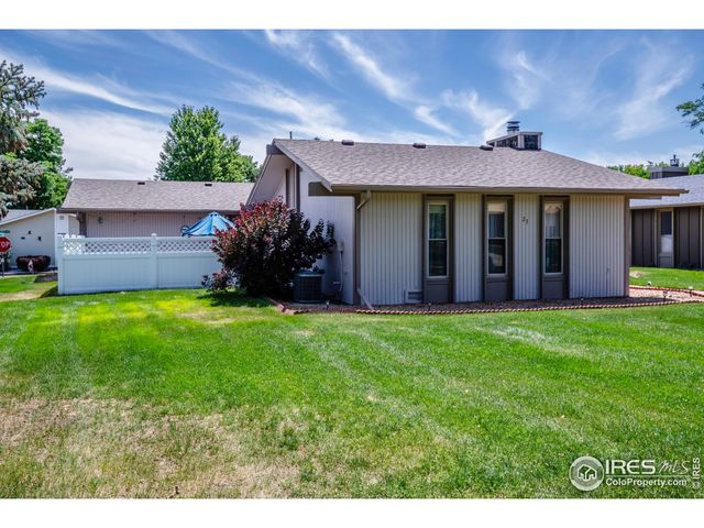 a view of a house with garden and yard