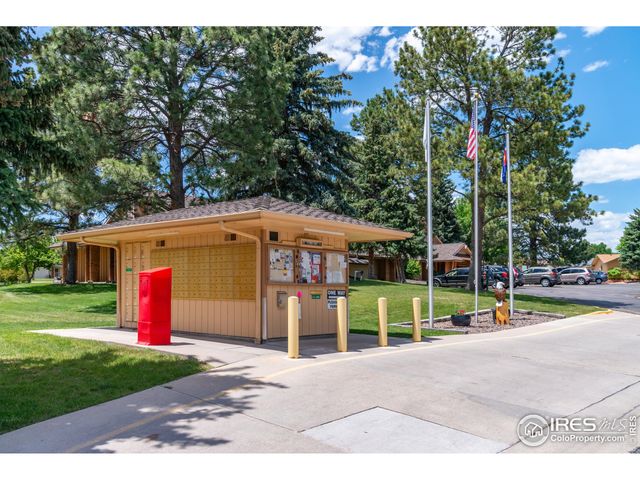 a view of a house with a garden and pathway