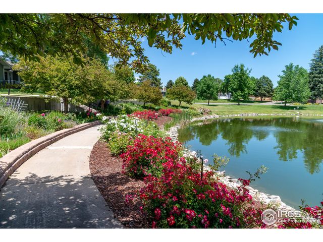 a view of a lake with a house in the background