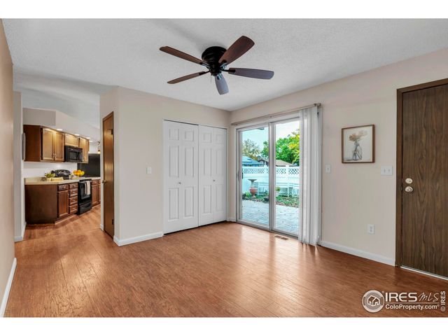 a view of a kitchen with a sink wooden floor and a window