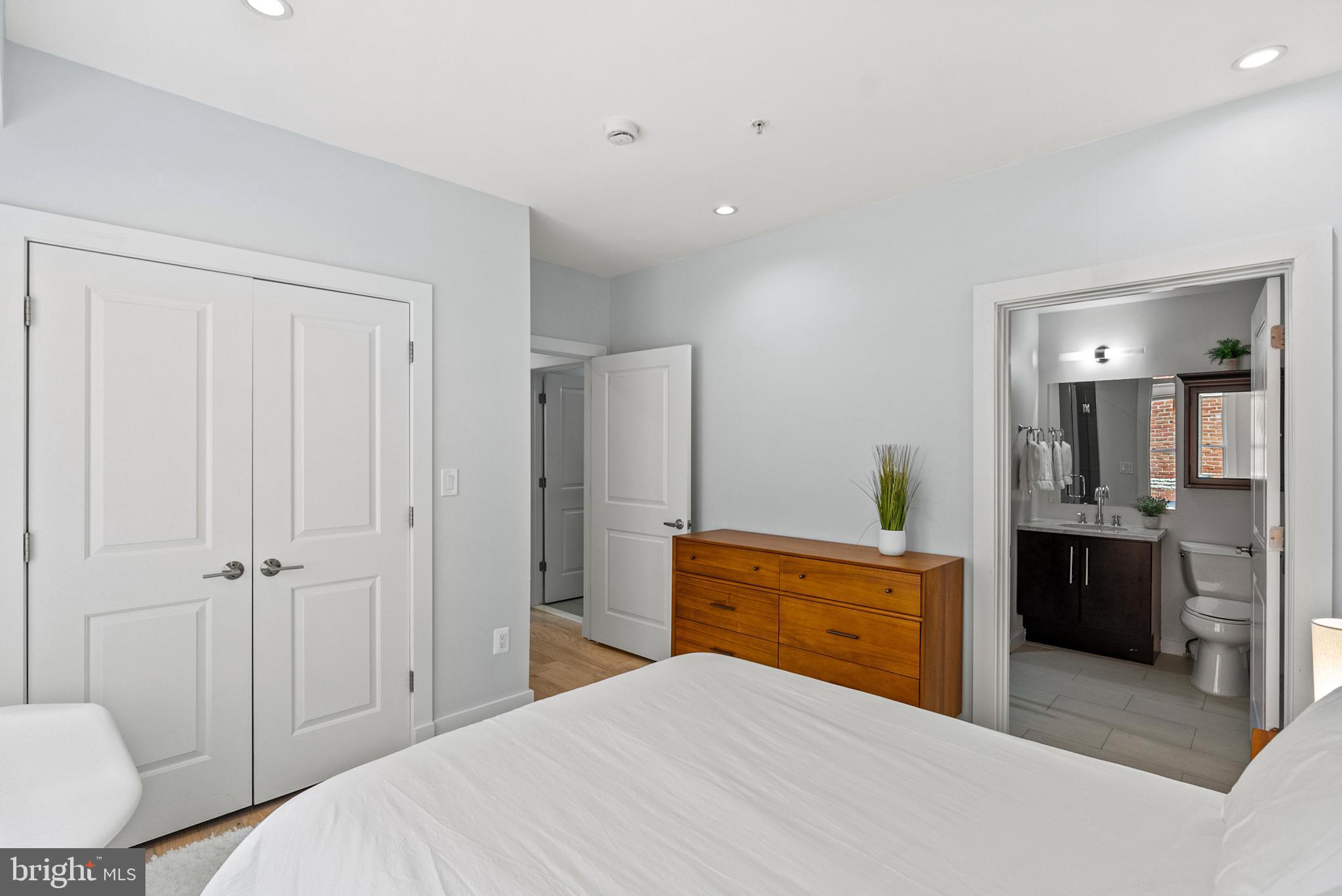 2101 11th Street Northwest, Unit 302 Washington, DC 20001 - Photo 12 of 26 a bedroom with a bed and a dresser