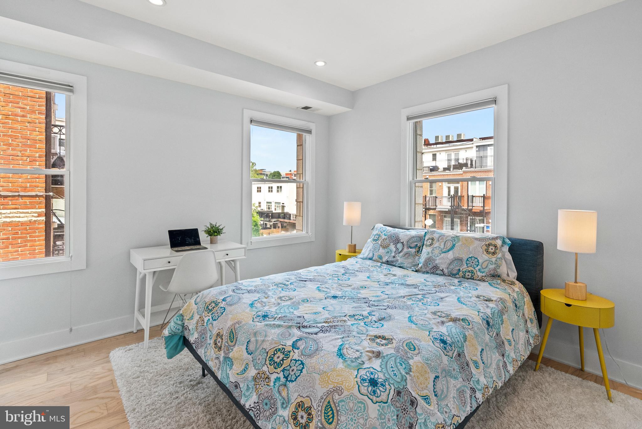 2101 11th Street Northwest, Unit 302 Washington, DC 20001 - Photo 14 of 26 a bedroom with a bed and a window