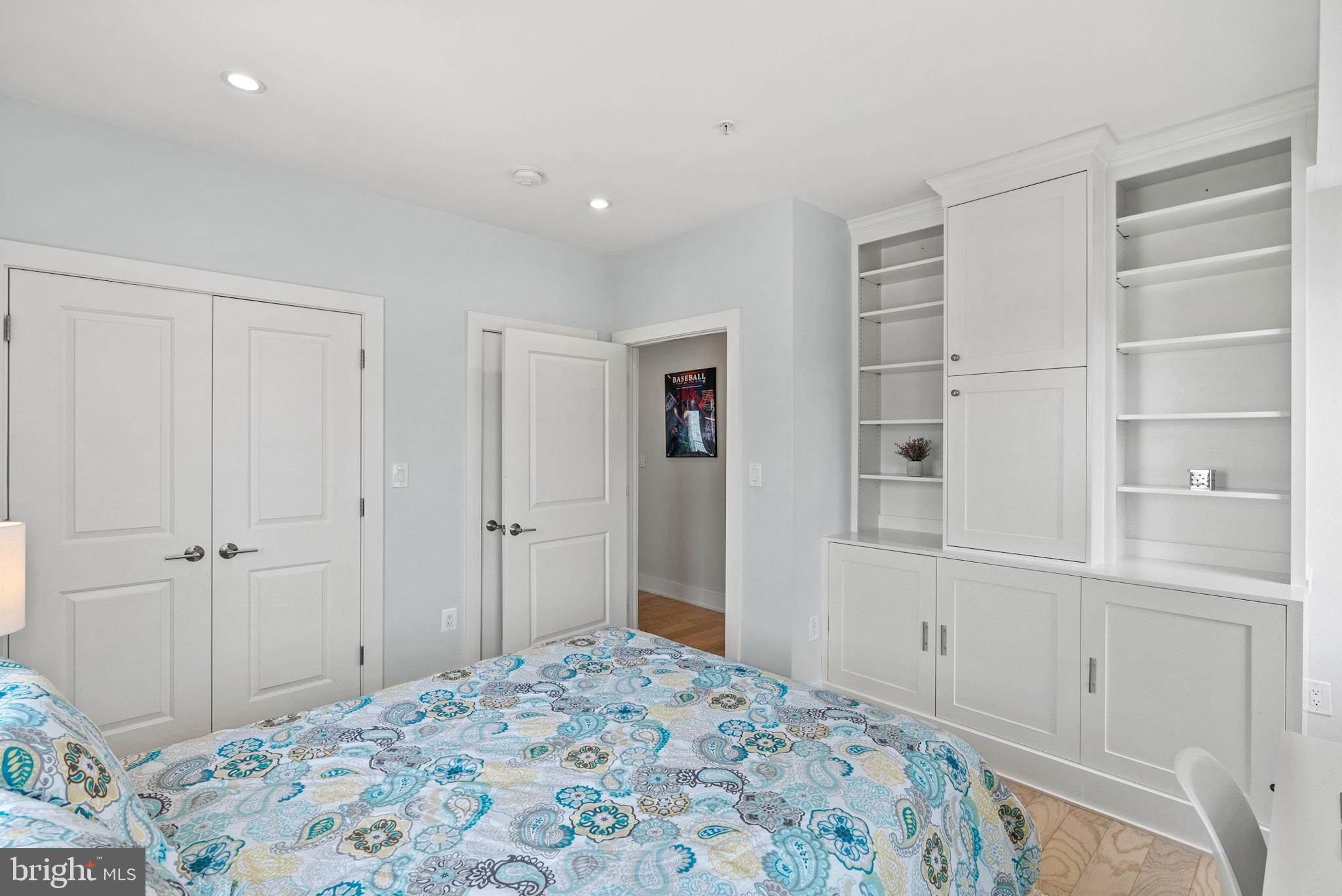 2101 11th Street Northwest, Unit 302 Washington, DC 20001 - Photo 15 of 26 a bedroom with a bed and closet