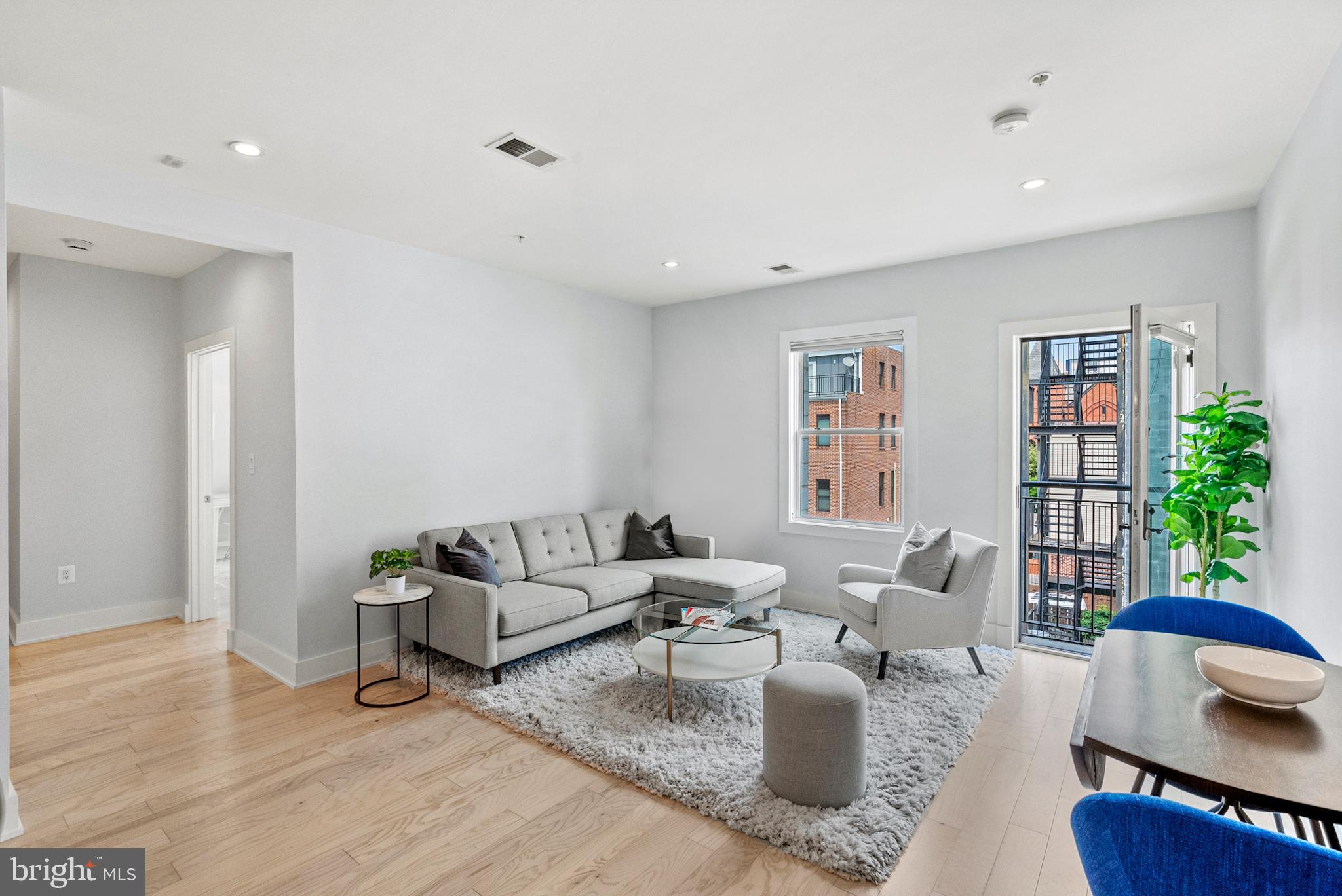 2101 11th Street Northwest, Unit 302 Washington, DC 20001 - Photo 2 of 26 a living room with furniture and a large window