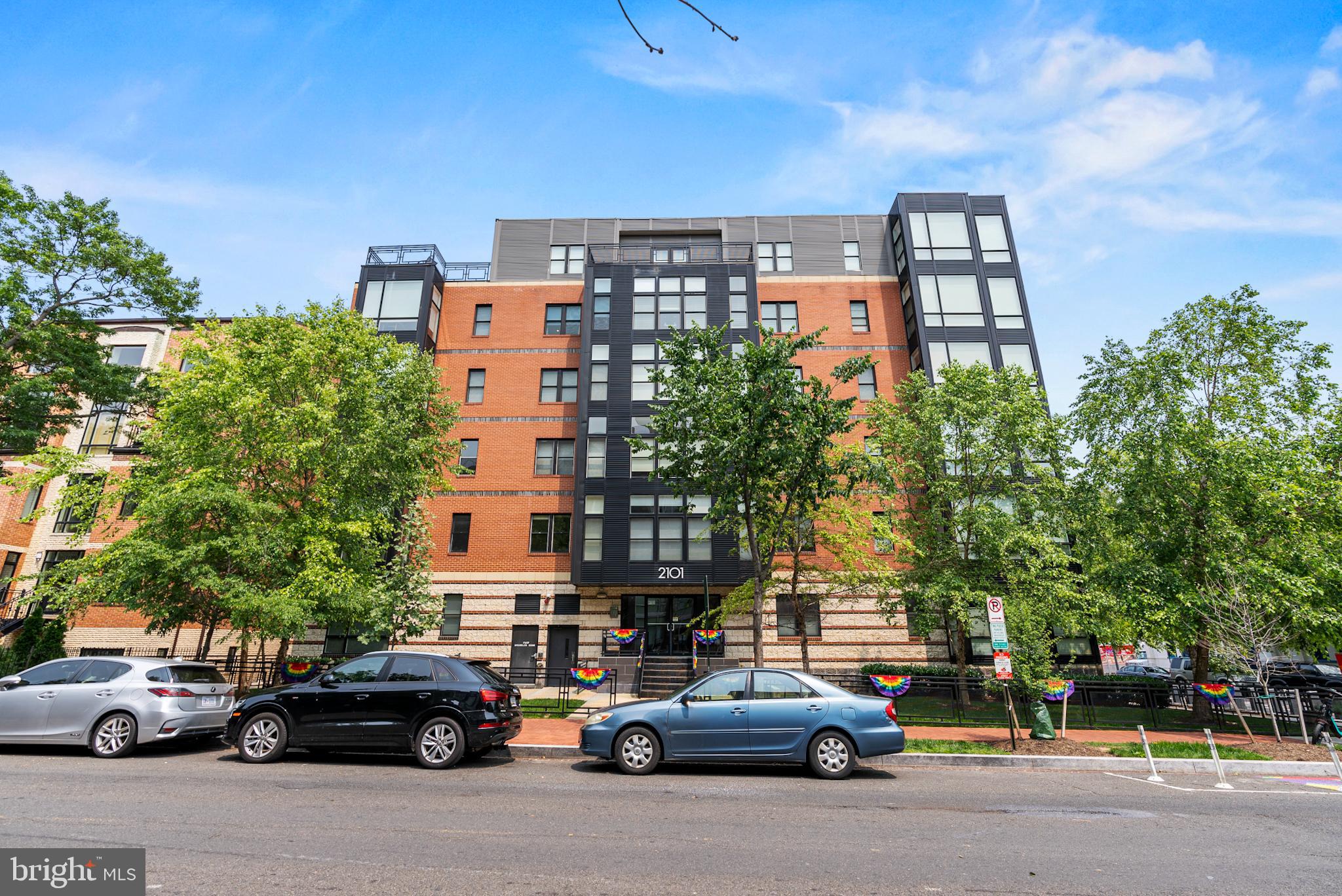 2101 11th Street Northwest, Unit 302 Washington, DC 20001 - Photo 23 of 26 a city street filled with lots of tall buildings and parked cars