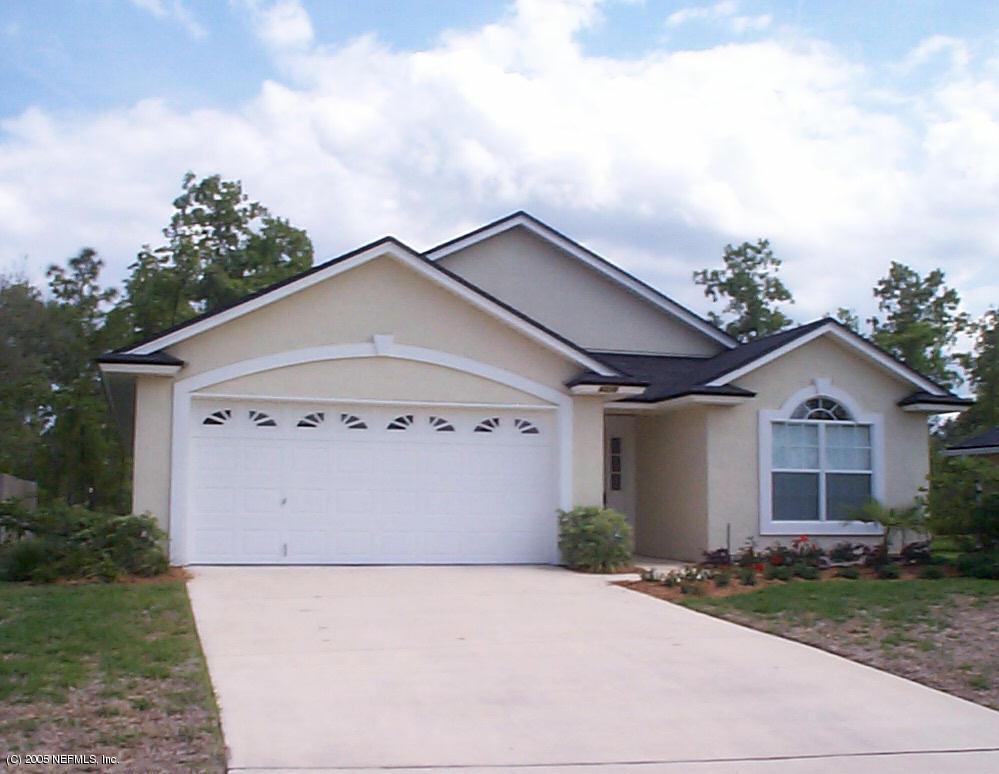 4316 Rye Jacksonville, FL 32259 - Photo 1 of 3 a view of a house with a yard and garage