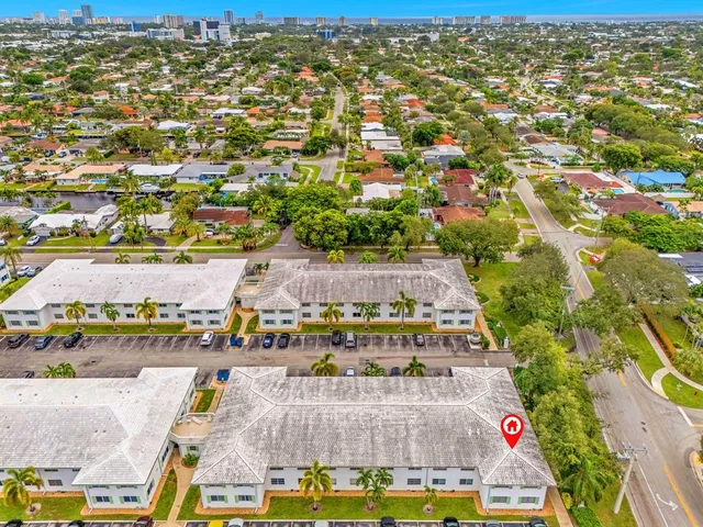an aerial view of residential houses with outdoor space