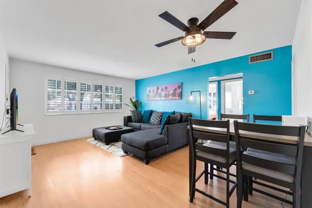 a living room with furniture and a window