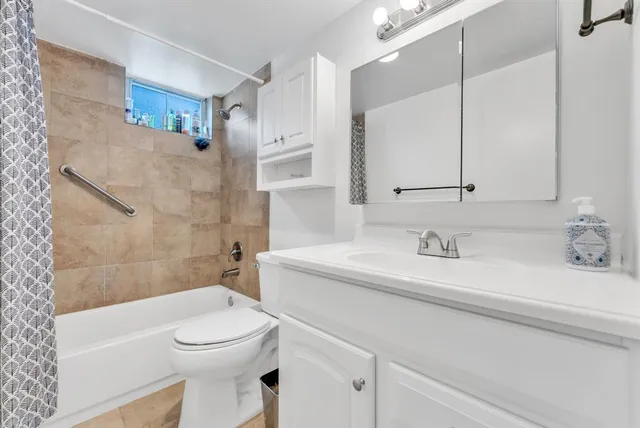 a bathroom with a sink a toilet and a bathtub