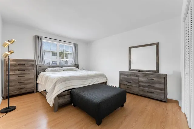 a bedroom with a bed and a dresser