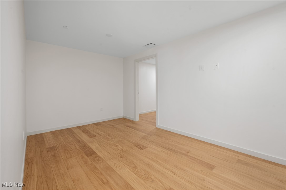 22700 Lake Road, Unit 306 Rocky River, OH 44116 - Photo 20 of 28 Spare room with light wood finished floors and baseboards