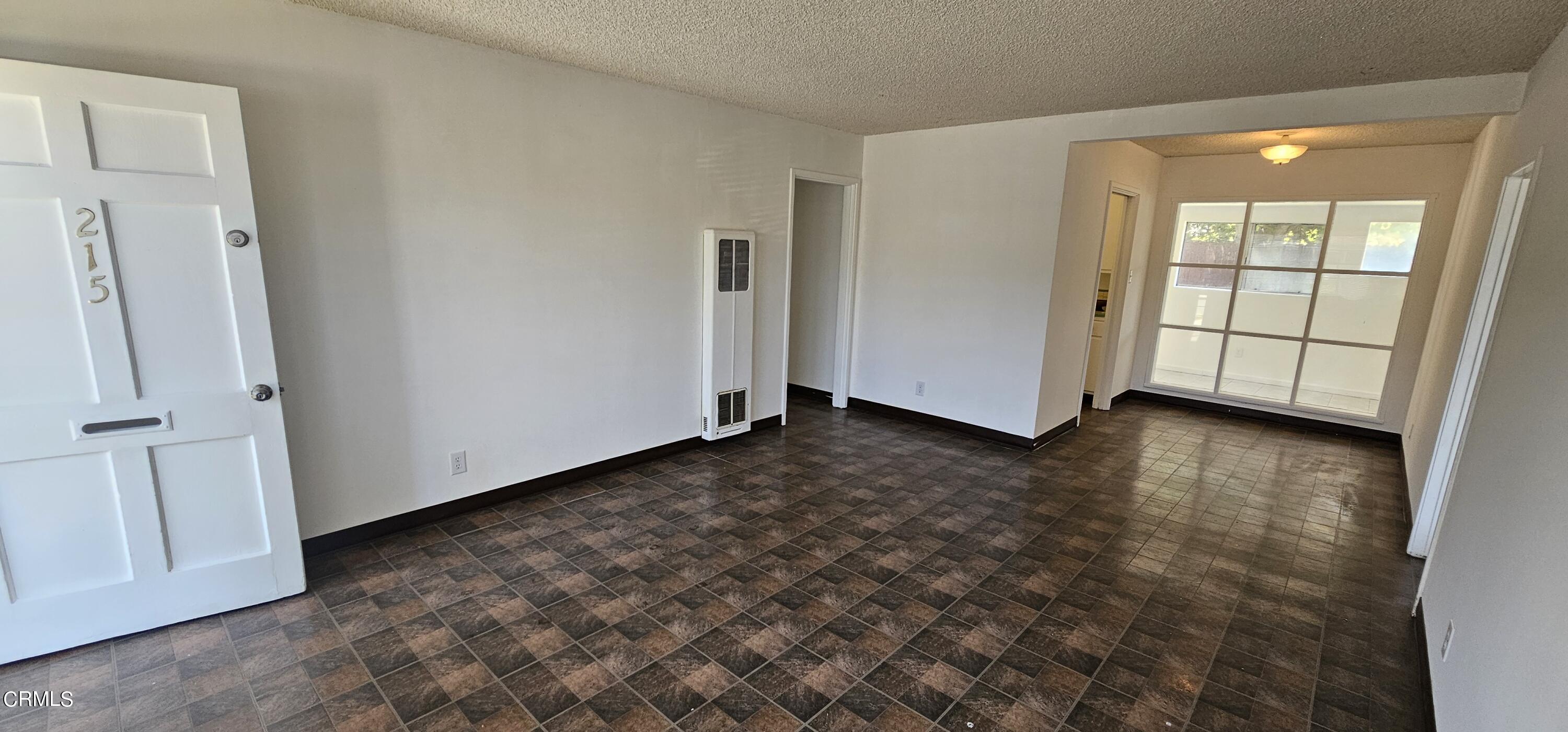 215 Thomas Avenue Oxnard, CA 93033 - Photo 4 of 18 an empty room with windows