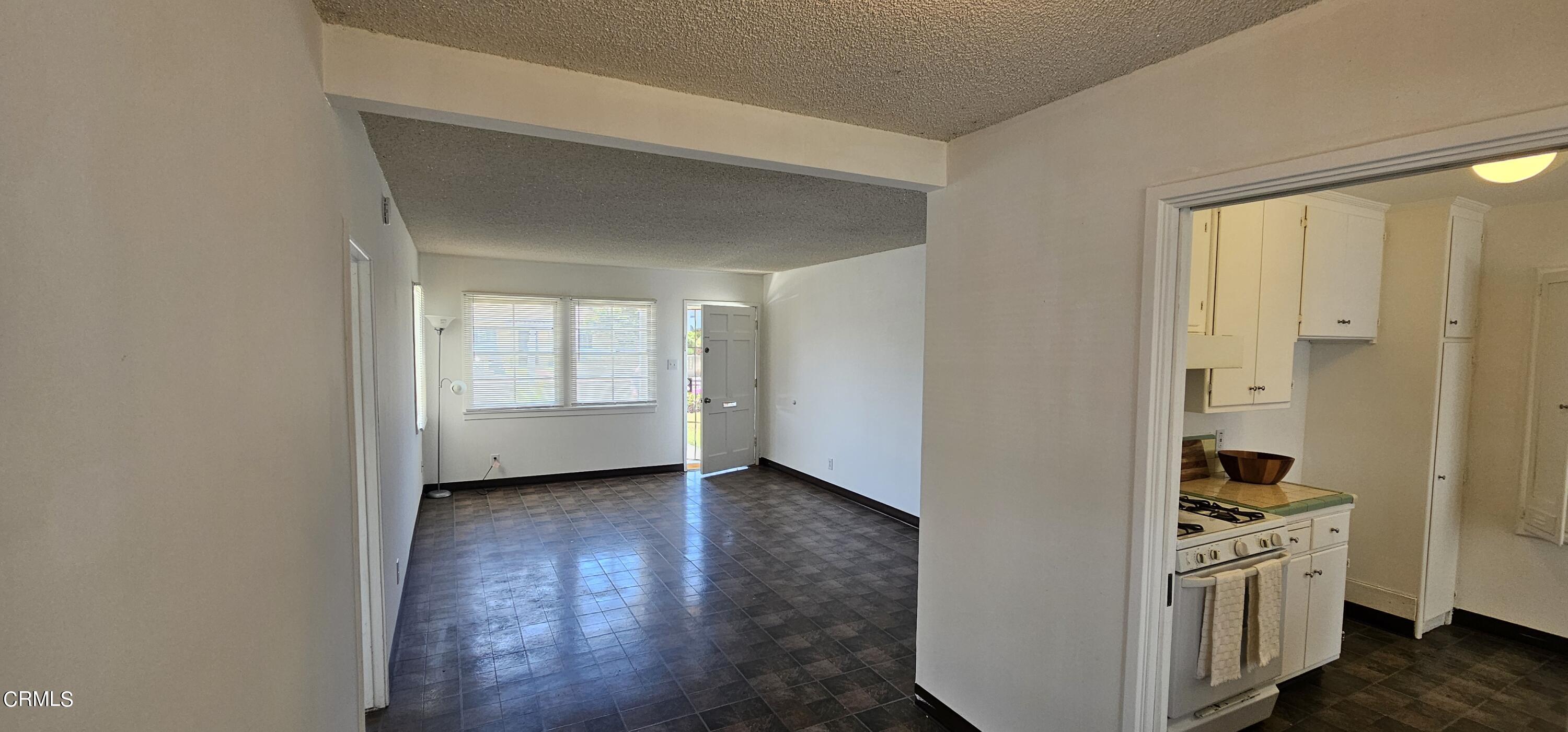 215 Thomas Avenue Oxnard, CA 93033 - Photo 5 of 18 a view of an empty room with wooden floor and closet
