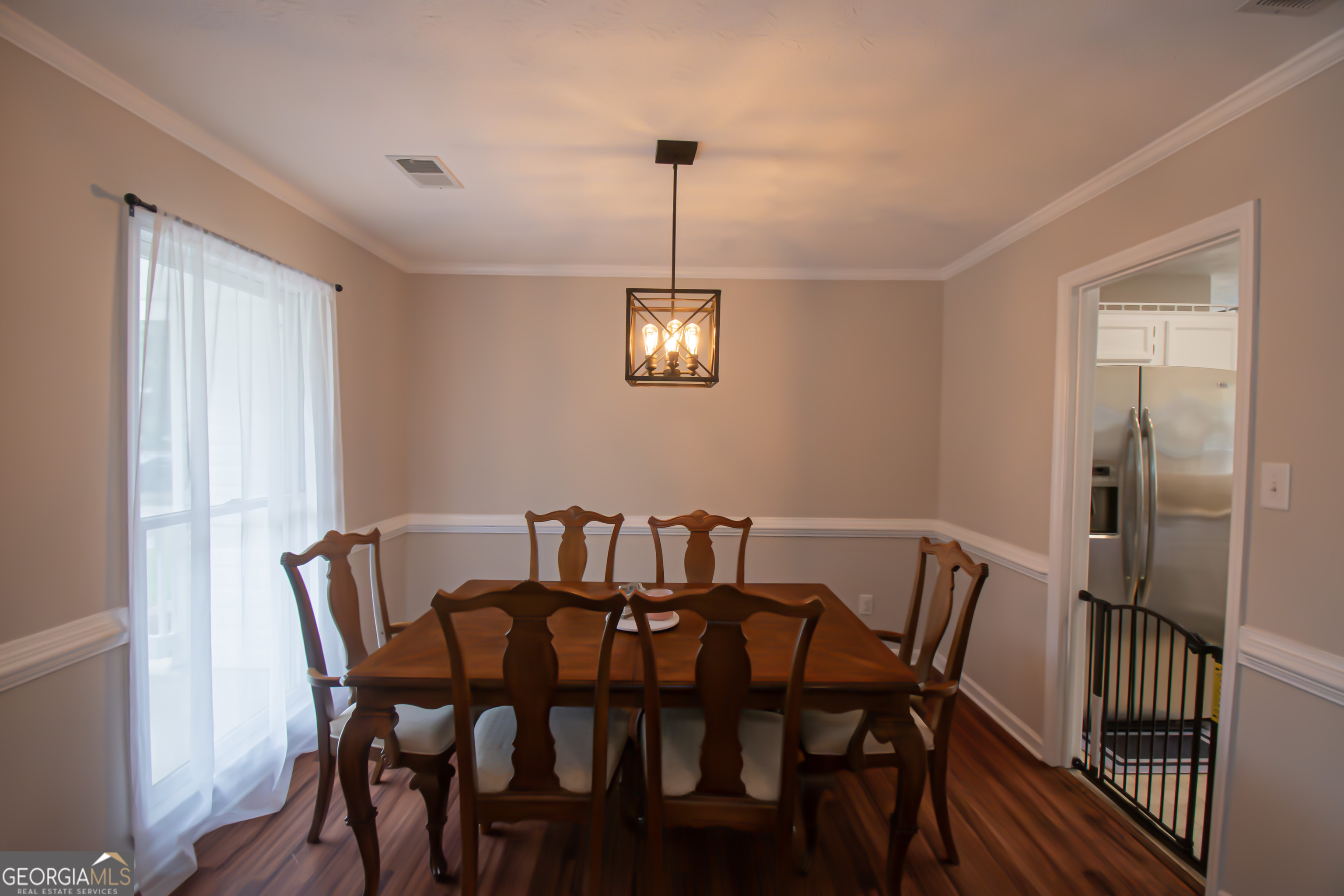 225 Graystone Drive Covington, GA 30014 - Photo 11 of 23 a view of a dining room with furniture window and wooden floor