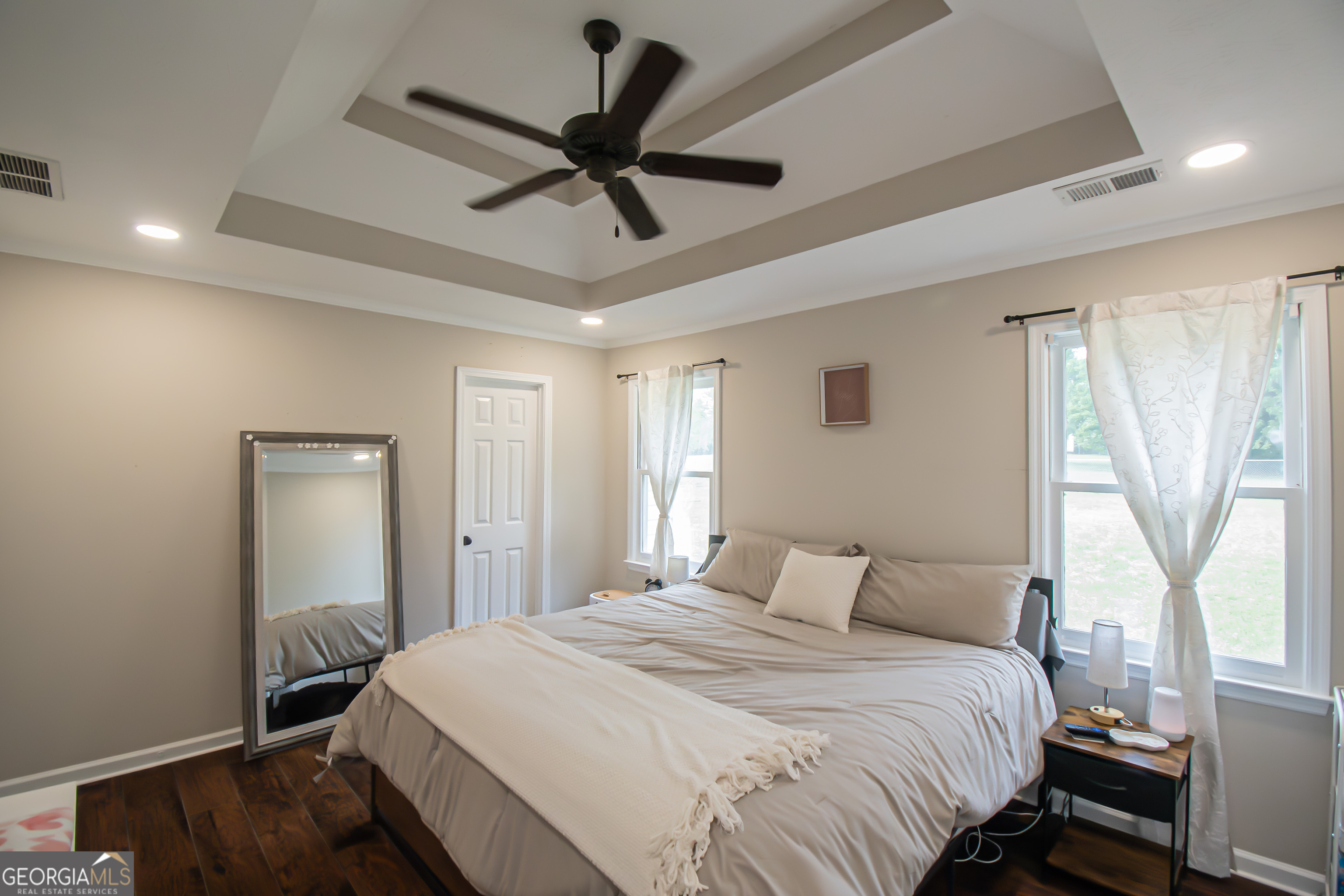 225 Graystone Drive Covington, GA 30014 - Photo 12 of 23 a bedroom with a large bed and a window